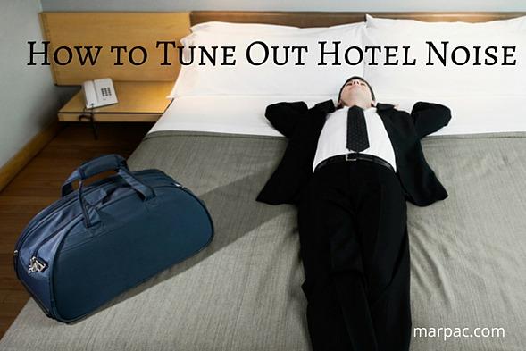 Business traveler lying on a hotel bed with a duffel bag at his side, overlaid headline How to Tune Out Hotel Noise