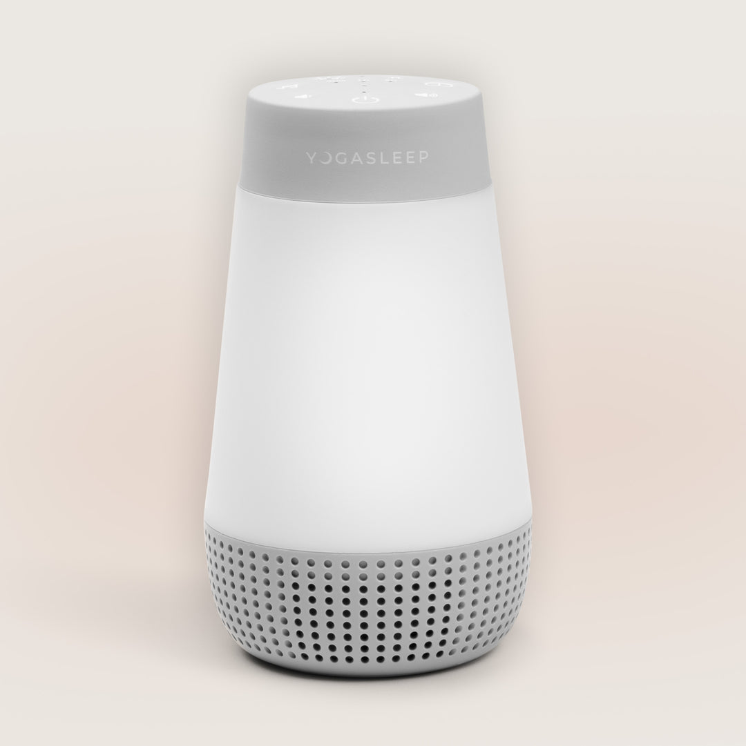 Front view of Travel-Friendly Baby Soother showcasing its speaker grille and white tapered body against a light background