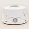 Dohm Classic - A White cylindrical sound machine with a front power switch on a plain background.