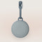 Hushh 2 - A Gray portable speaker with a hanging clip.