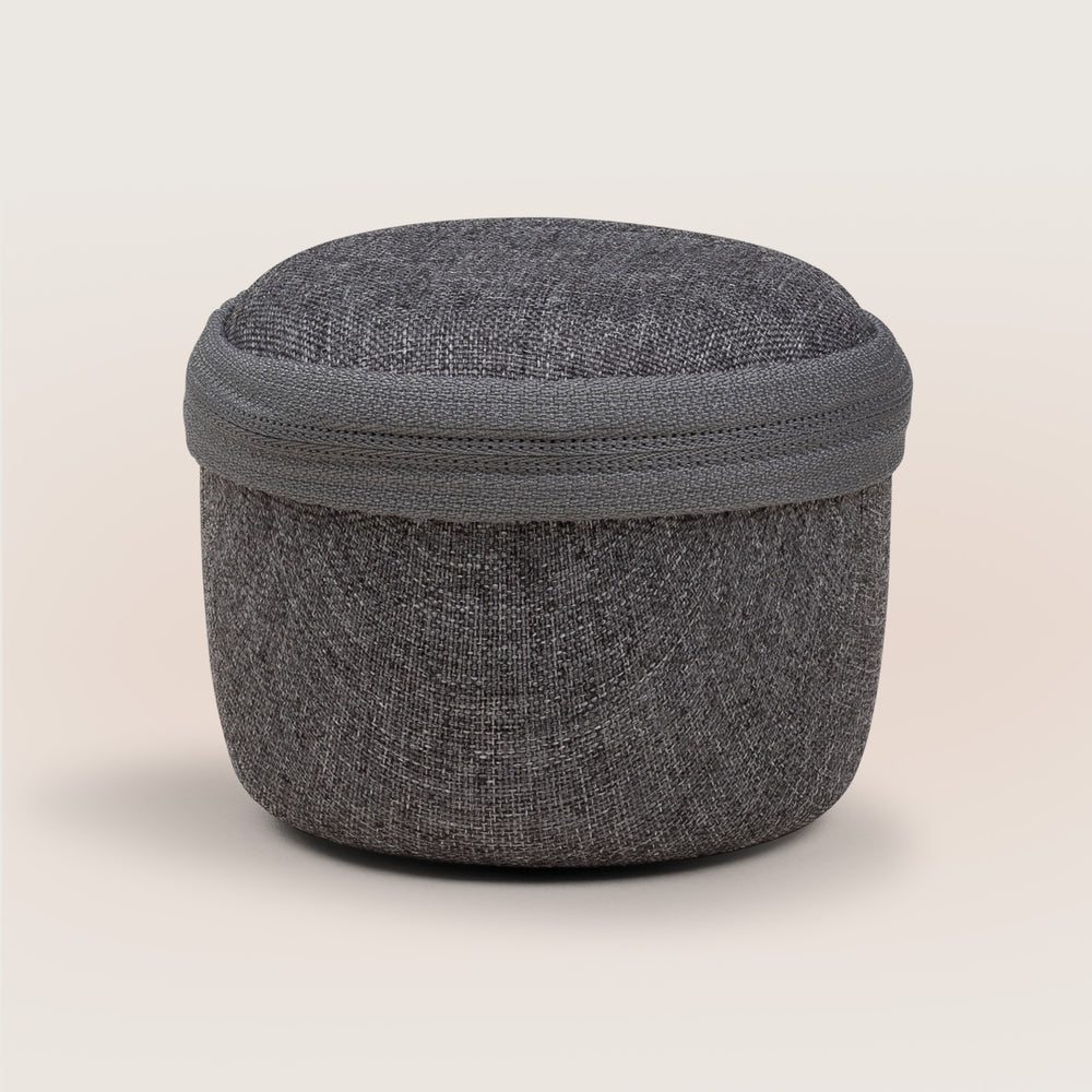 Front view of Travel Mini Case showing charcoal gray woven fabric exterior and zippered lid on neutral background