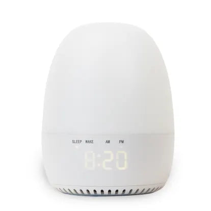 White egg-shaped alarm clock with digital display.