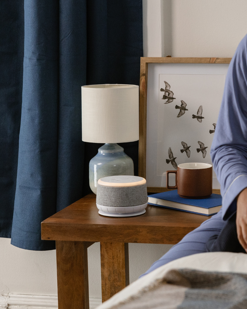 Sound machine beside a bed for better sleep