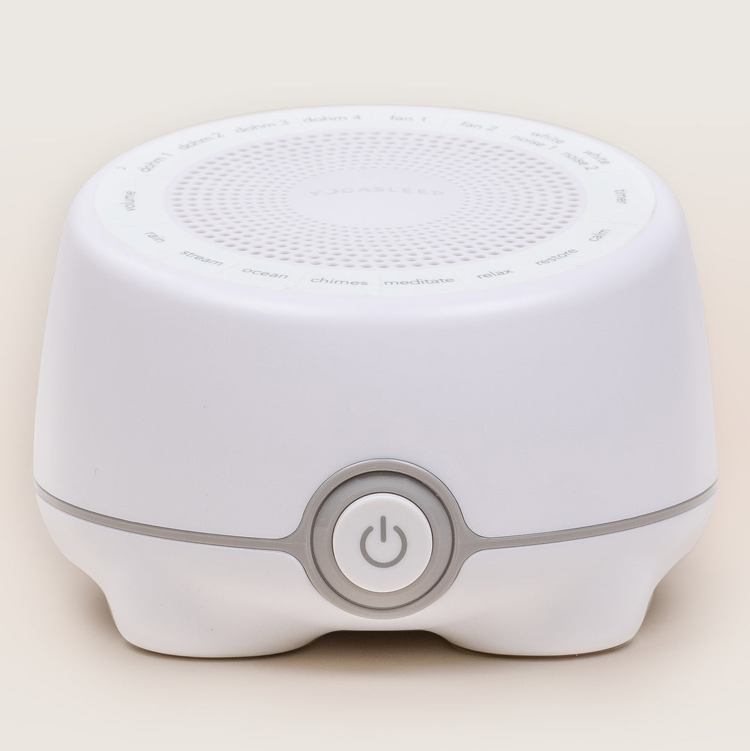 Front view of the white Whish multi-sound machine showcasing top sound controls and a central power button