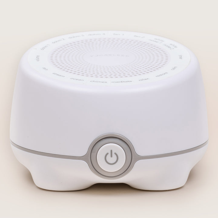 Front view of the white Whish multi-sound machine showcasing top sound controls and a central power button